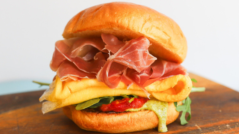 Close up of prosciutto breakfast sandwich