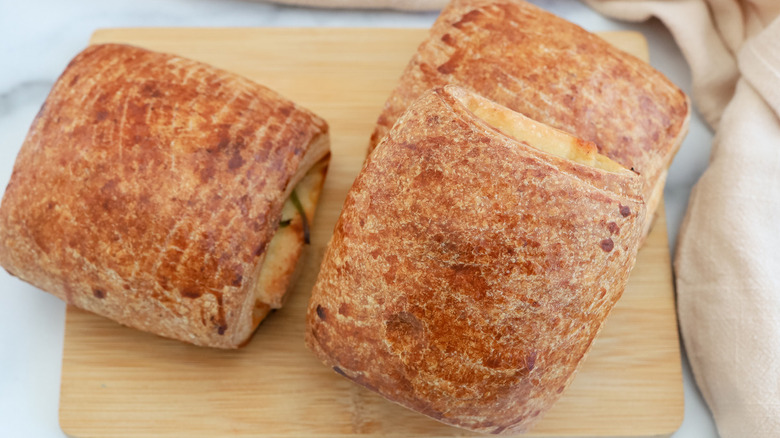 croissants on small wooden board