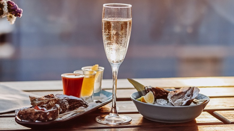 A glass of Prosecco with oysters