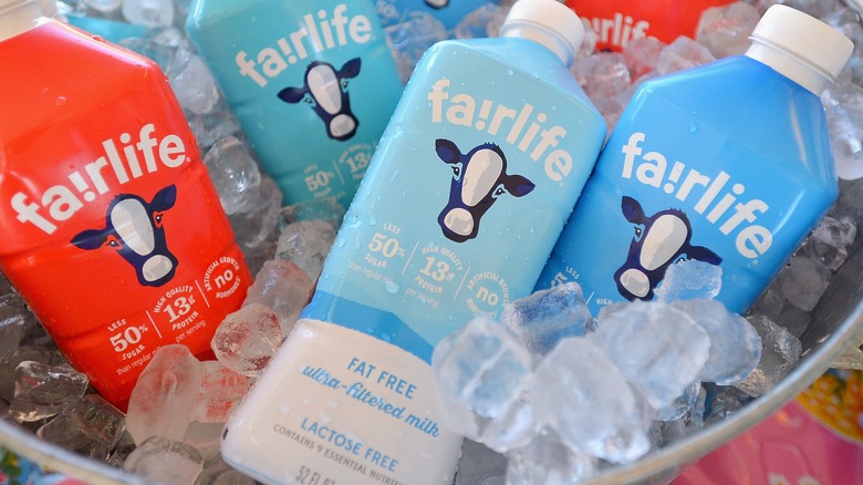 Four bottles of Fairlife ultra-filtered milk on ice