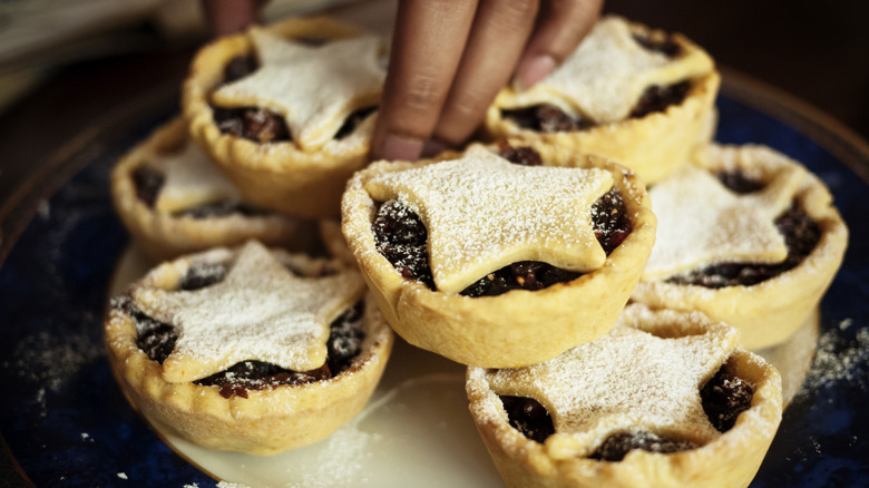 hand grabbing mince pies