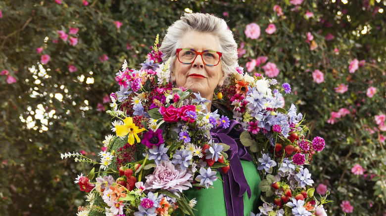 Prue Leith wearing flower garland