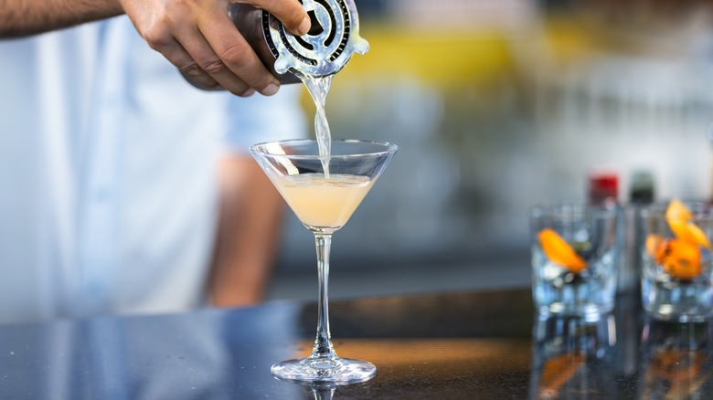 Person making martini