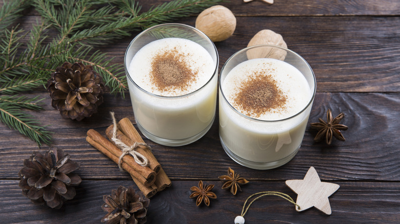 eggnog with cinnamon sticks