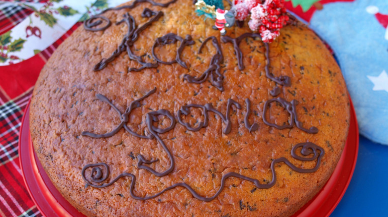 a festive vasilopita with greek new year's message