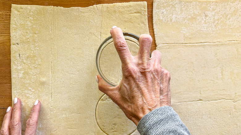 hand using glass for circles