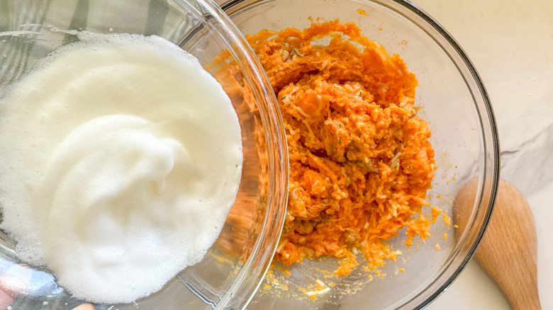 adding egg whites to bowl