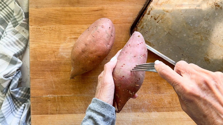 hand poking sweet potato