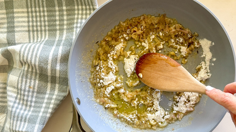 hand stirring the mixture