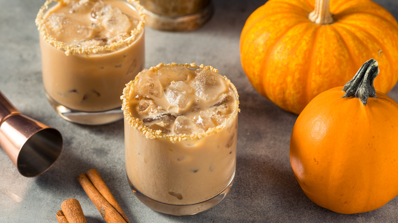 two creamy lowball cocktails with pumpkins