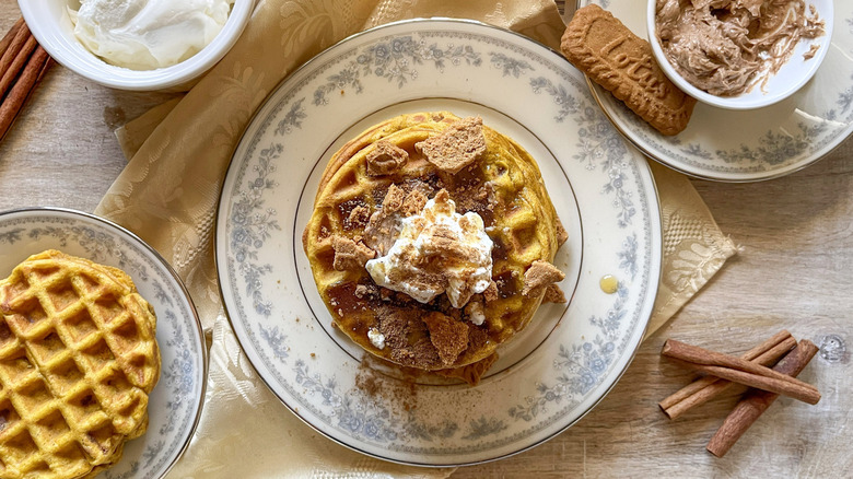 stacked pumpkin pancaked with cinnamon butter