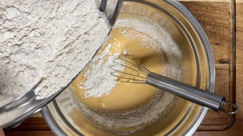 combining waffle batter in bowl