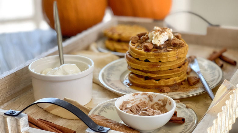 stacked pumpkin pancaked with cinnamon butter