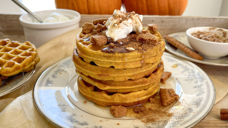 stacked pumpkin pancaked with cinnamon butter