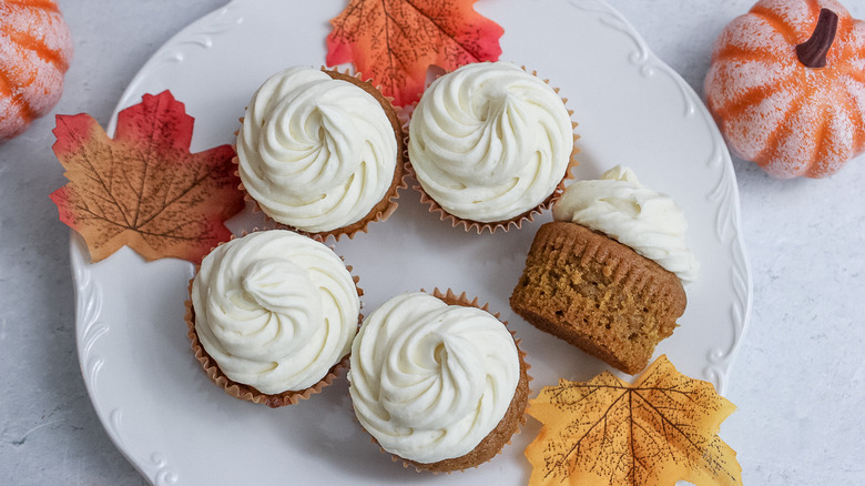 plate of frosted cupcakes