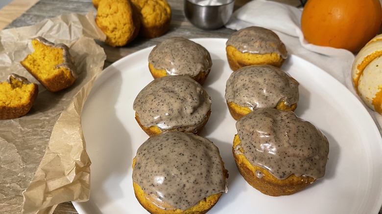 iced pumpkin muffin donuts on plate