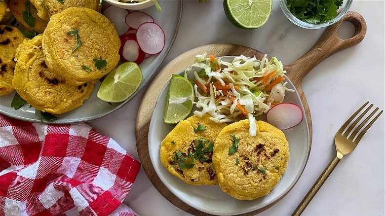 pupusas on plate with slaw 