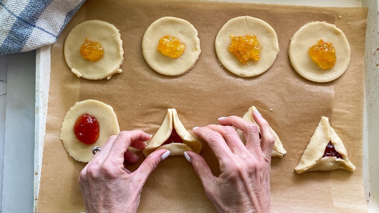 shaping dough into triangles