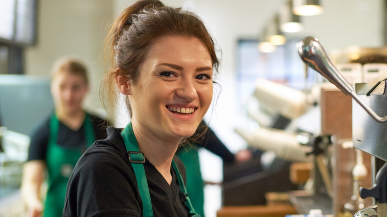 A smiling barista from Starbucks