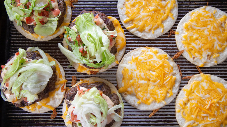 burgers and tortillas on grill 