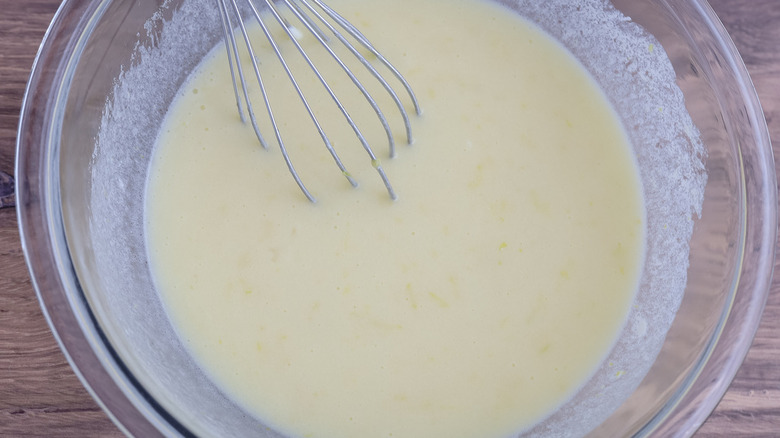 yellow liquid in clear bowl