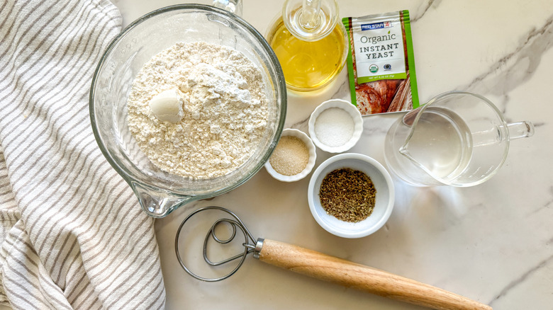 Ingredients for maneesh bread on marble counter