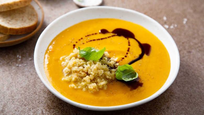 creamo f pumpkin soup with a scoop of quinoa