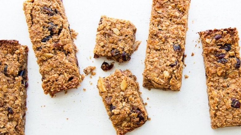 Several brown granola bars on a white table