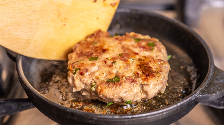 burger patty in skillet