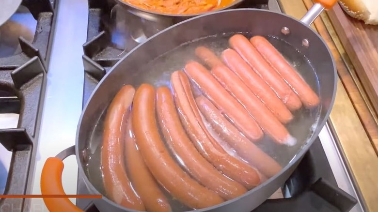hotdogs simmering in boiling water