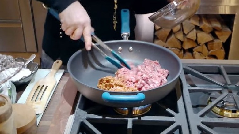 cooking meat in a skillet