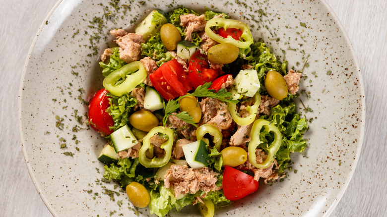 Mediterranean tuna salad with olives, pepperes, tomatoes and feta