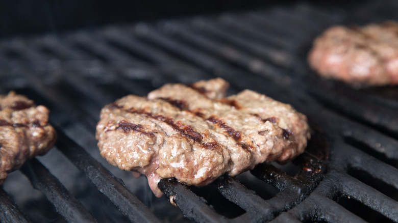 hamburger patties on grill