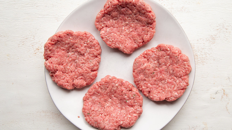 uncooked burger patties