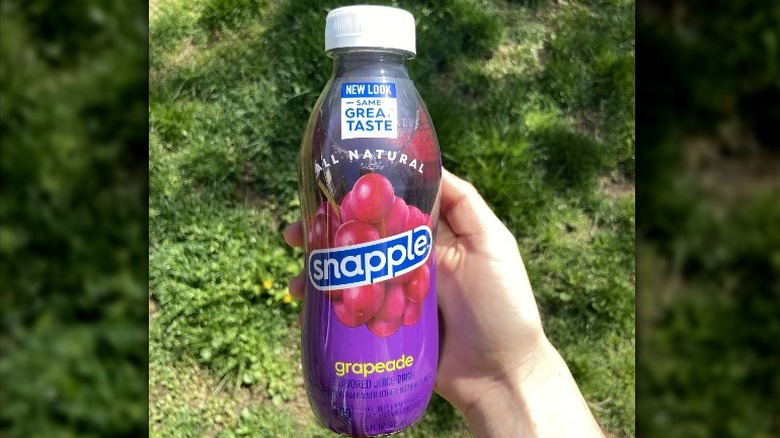 Bottle of Snapple in grass