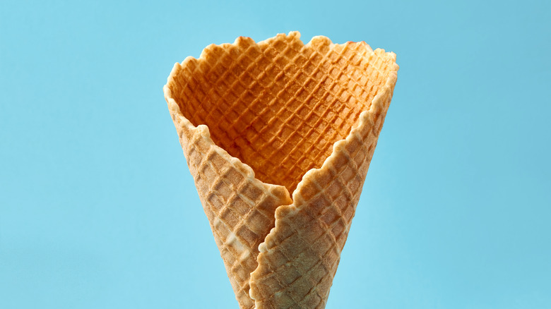 Waffle cone on blue background