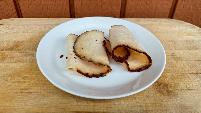 Chicken breast slices on plate