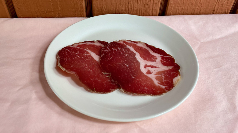 Capocollo slices on plate