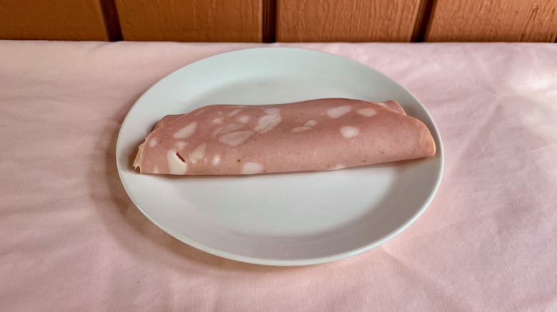 Mortadella slice on plate