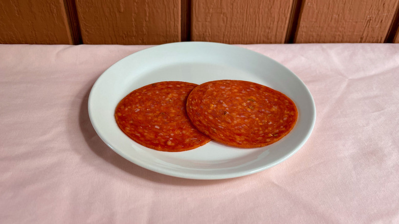 Large pepperoni slices on plate