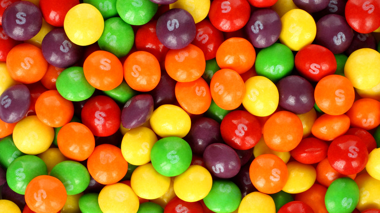 a heap of unpackaged Skittles