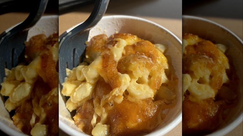 Macaroni and cheese with black fork