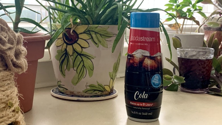 sodastream cola drink and plants