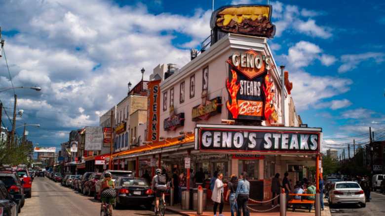 The orange and neon lit Geno's Steaks in South Philadelphia