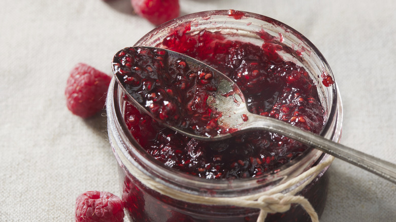 raspberry jam with spoon