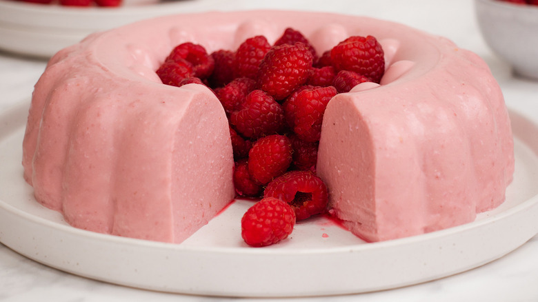 raspberries in the middle of a raspberry blancmange 