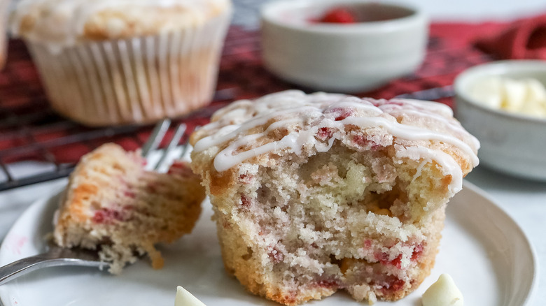 close up of the inside of a raspberry white chocolate chip muffin