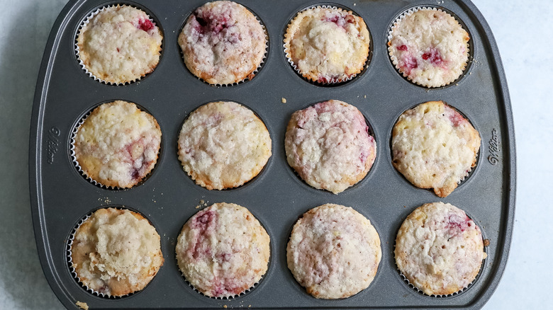 raspberry muffins in pan