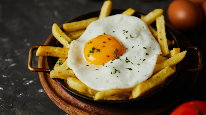 over easy egg on top of fries