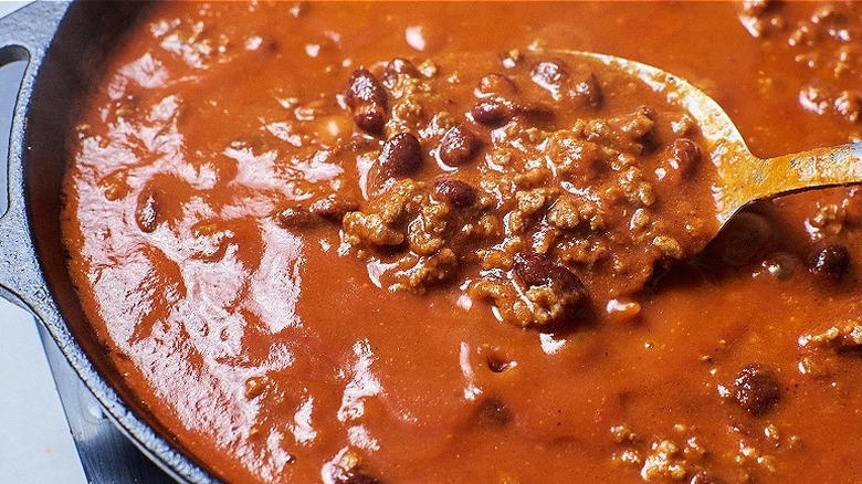 stirring beef filling in skillet